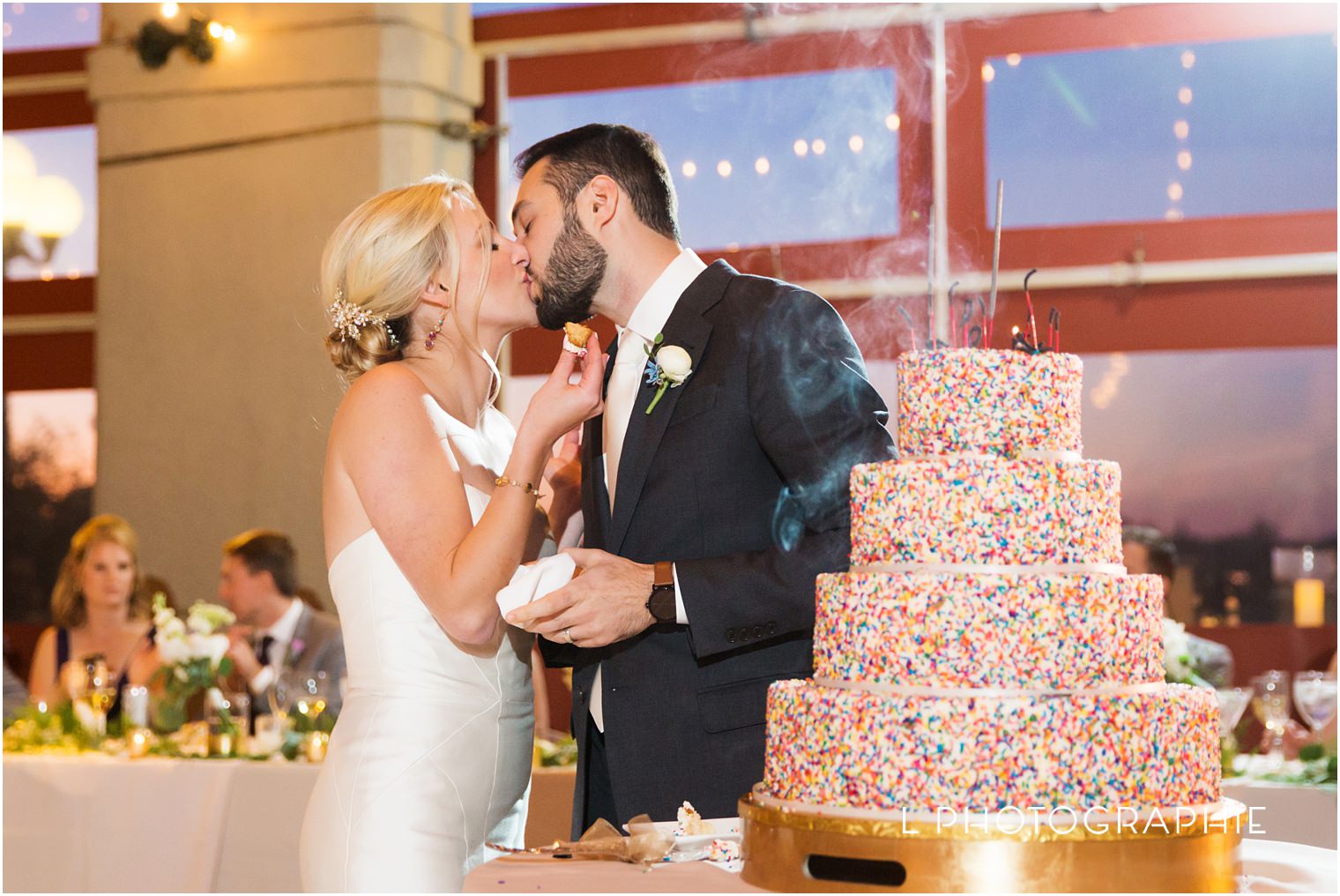 confetti wedding cake with sparklers,dylan,isabella,jewish wedding at the worlds fair pavilion,shades of lavender palette wedding colors,sparkler exit photos,summer wedding in st. louis in forest park,worlds fair pavilion wedding photos,